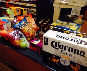 Grocery line image  (Identify the Corona, Sam Adams, and Gluten-free beer, Redbridge, pita chips, Tostito chips and salsa, gluten-free crackers, Ritz, watermelon, Dunkin’ Donuts Decafe coffee, peanut butter, bananas, milk, Corn Flakes, Cheerios)